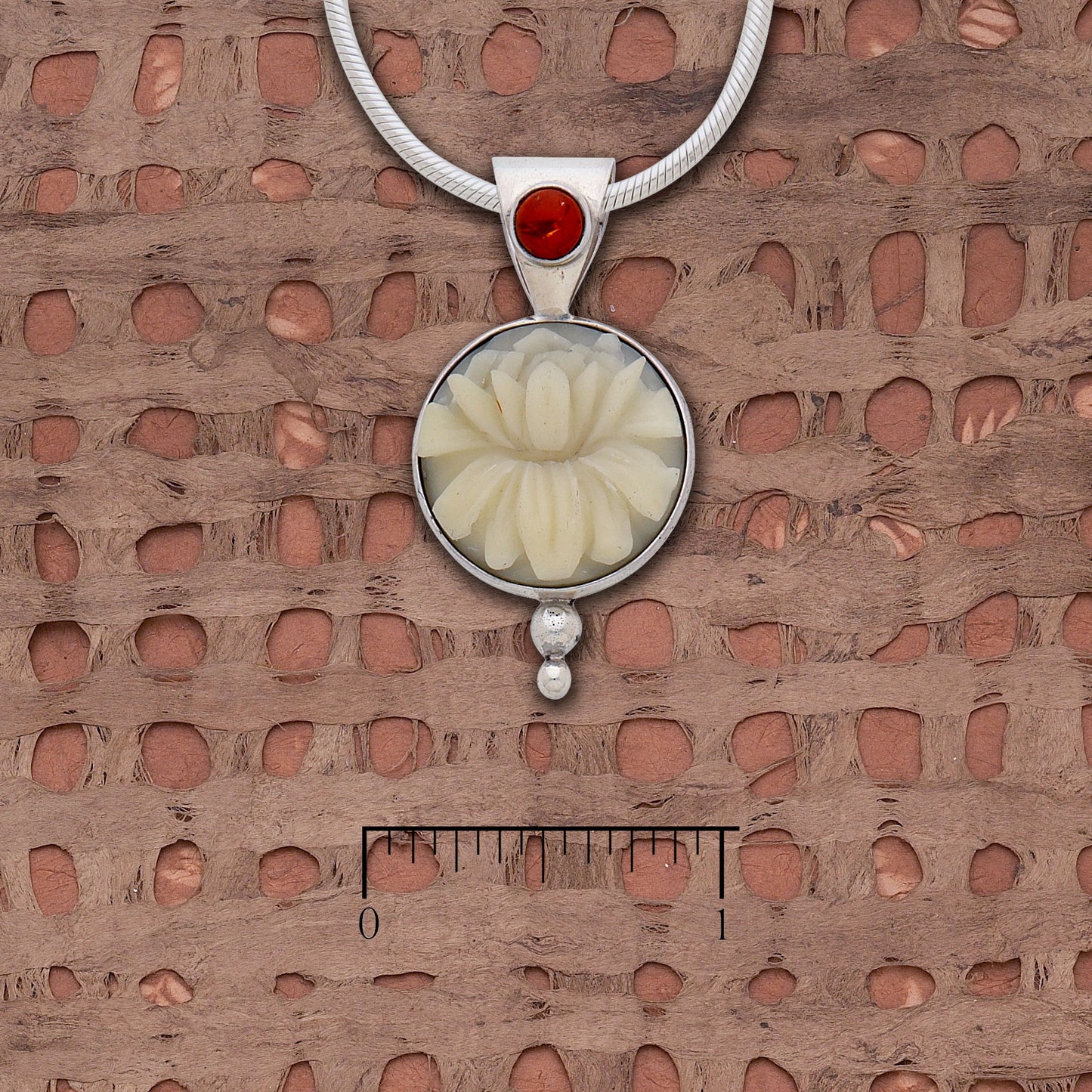 Tagua "Lotus" and amber pendant